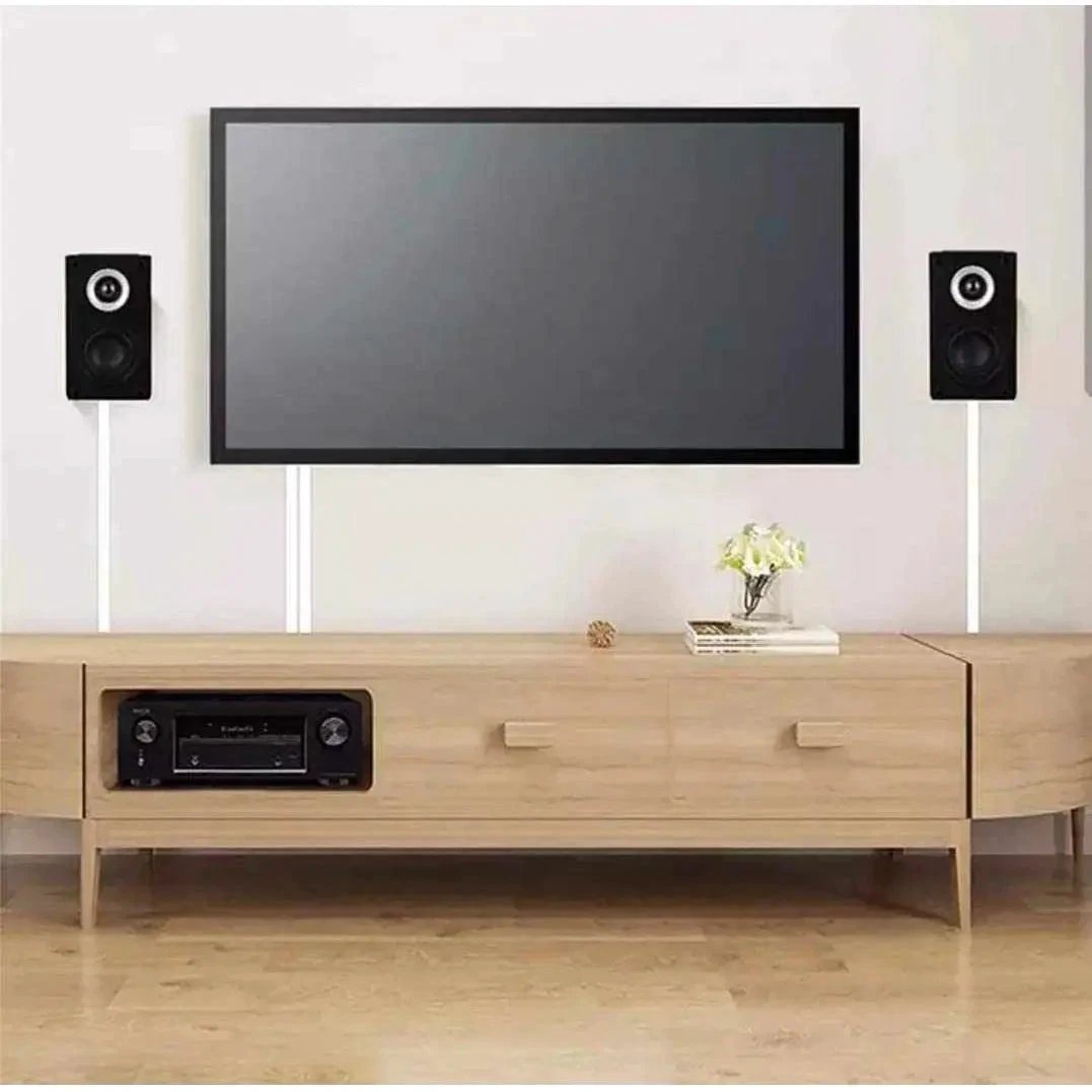 Deluxe self-adhesive PVC trunking cable cover, pack of 3, white, mounted on wall beside TV and speakers