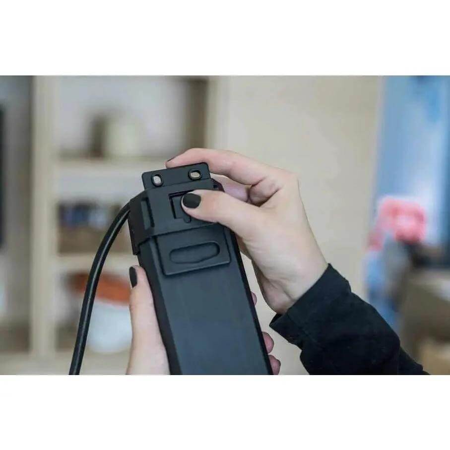 Brennenstuhl Premium-Line Multistandard 5-way extension lead in black, held by hands UAE