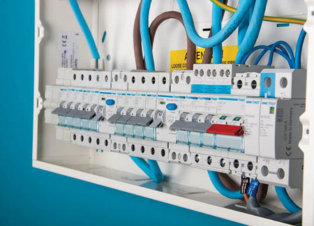 Hager DIN-rail modular protection devices installed in a distribution board — genuine Hager installation photography (representative application)